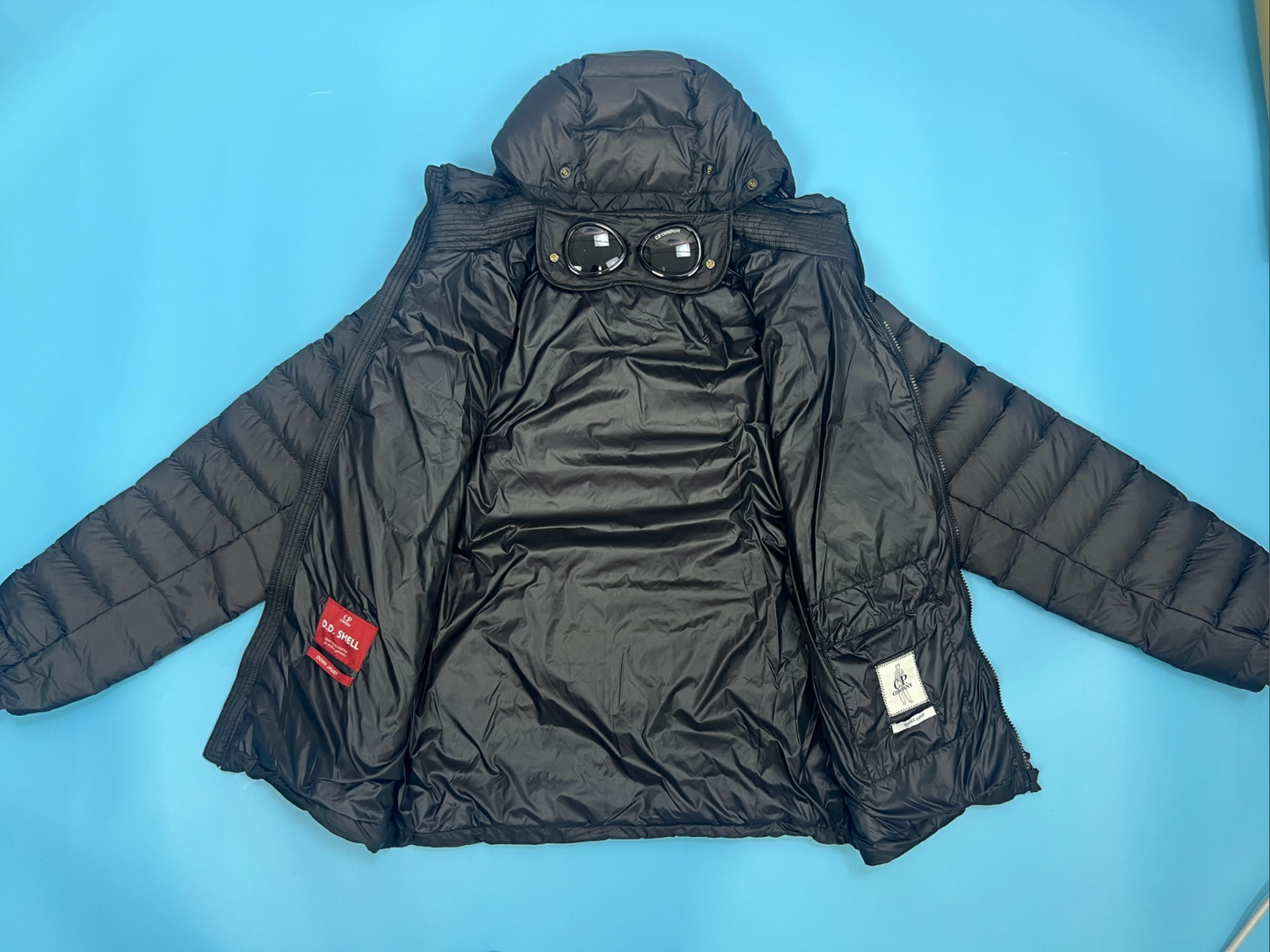 CP컴퍼니 DD Shell 고글 후드 패딩 점퍼